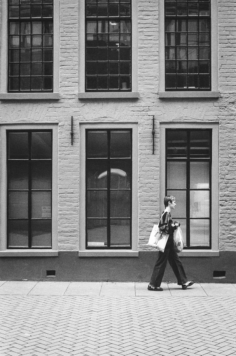 Passerby shot on Ilford Pan 400 with a Minolta X-300, by Ruerd Leenstra