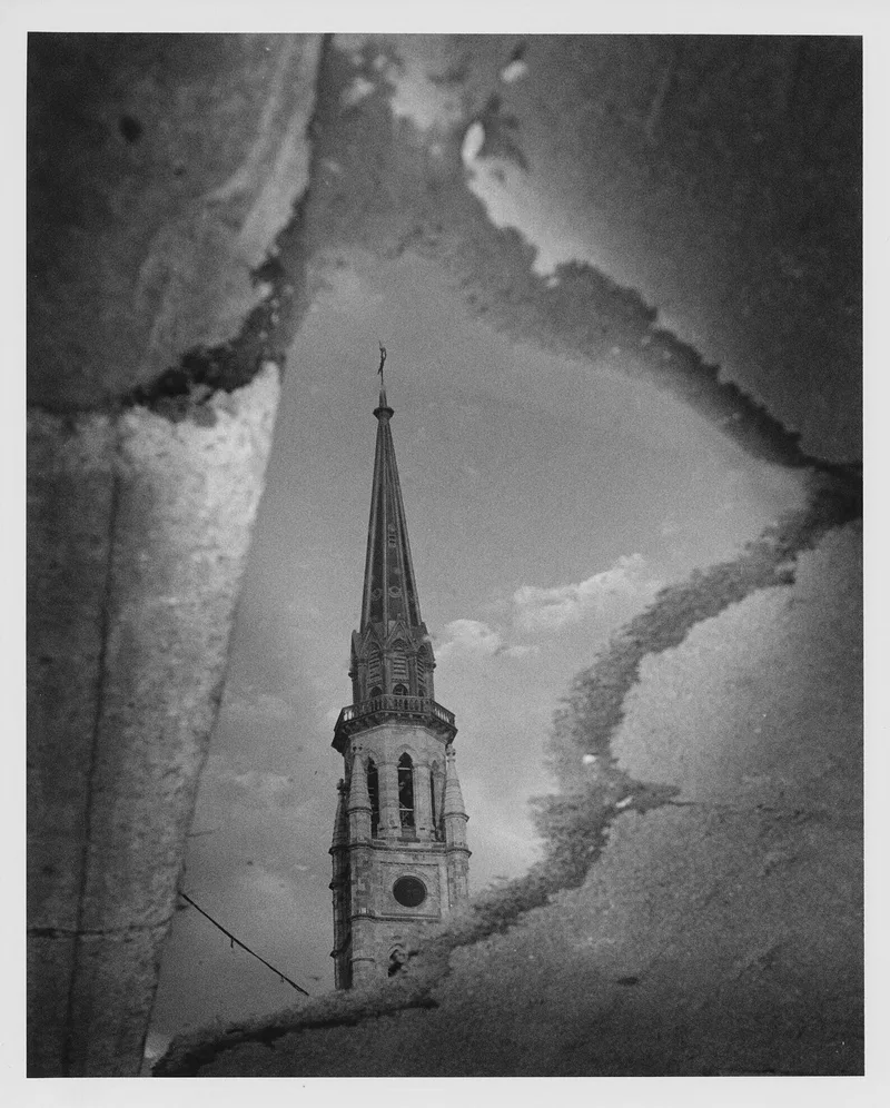 Reflection in a puddle shot on Ilford Delta 400 with a Minolta Dynax 7, developed at Home / Self-Developed, by Luc Béliveau