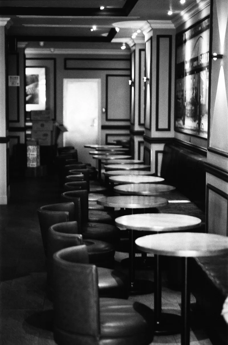Empty coffee shop shot on Adox CHS 100 II with a Leica M6 TTL, developed at Home / Self-Developed, by MarkTheMutant