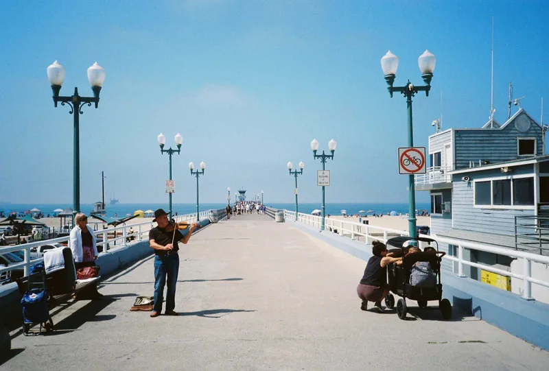 Pier Violinist shot on Kodak UltraMax 400 with a Olympus XA3, developed at The Photo Lab, by Clint