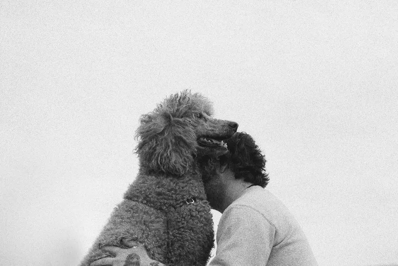 A Boy And His Dog shot on Ilford Delta 3200 with a Nikon F3 HP, developed at Moon Photo, by Aaron Yost