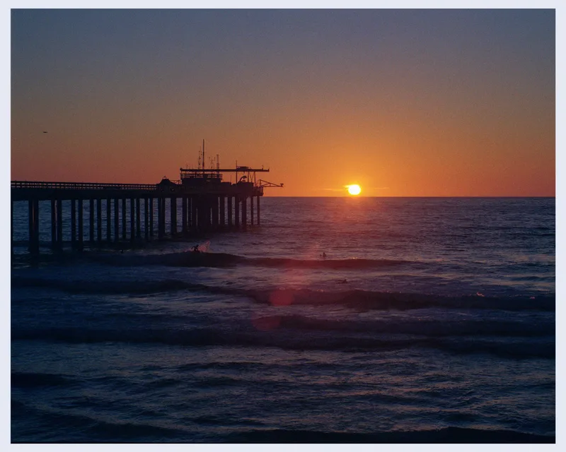 Surfing at Sunset shot on Kodak Gold 200 with a Canon AE-1, developed at Nelson Photo Supplies, by Leland