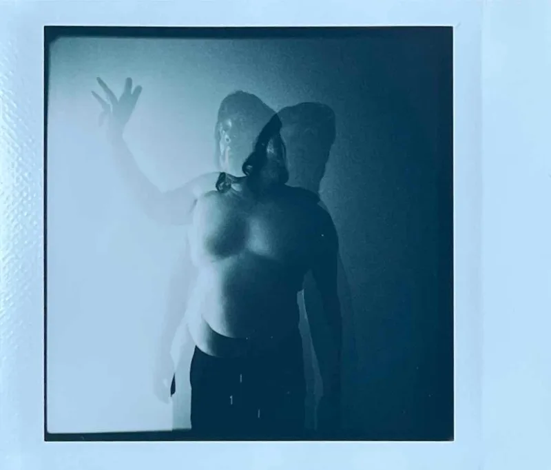 Say Hello Wave Goodbye shot on Fujifilm Instax Square Monochrome with a Hasselblad SuperWideC, by BadMonkey