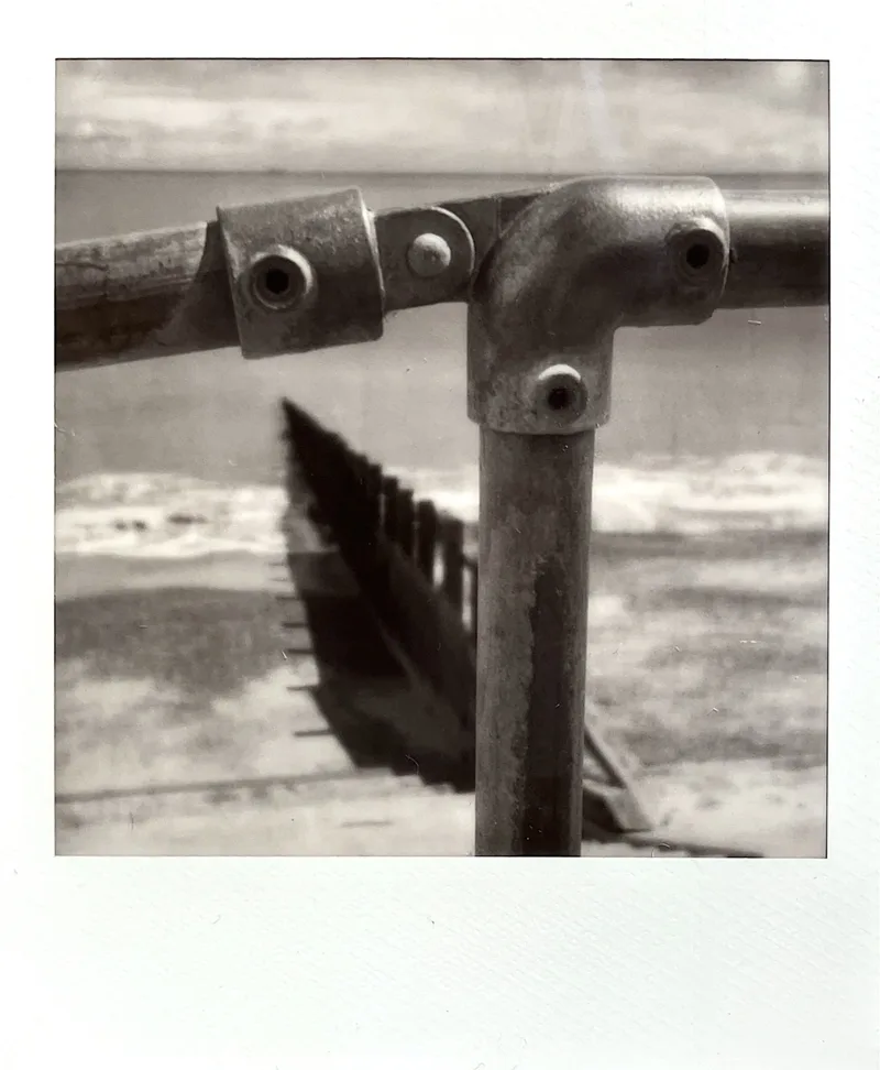 Railing shot on Polaroid B&W 600 with a Polaroid I-2, developed at Instant Film, by MelvynJ