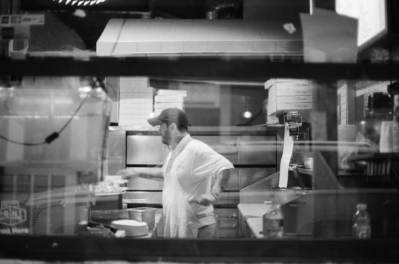 Pizza Parlor shot on Ilford Kentmere Pan 400 with a Nikon FA, developed at Nice Film Club, by Leah