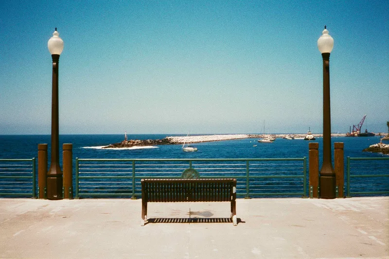 Bench on the Pier shot on Harman Phoenix 200 with a Ricoh 35ZF, developed at Legacy Film Lab, by Clint