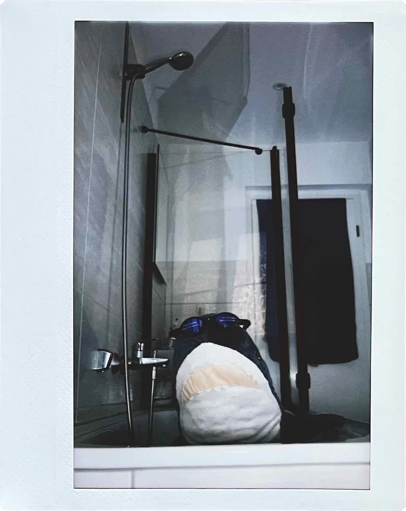 Blahaj taking a morning bath shot on Fujifilm Instax Wide with a Fujifilm Instax Wide 300, by Nathan