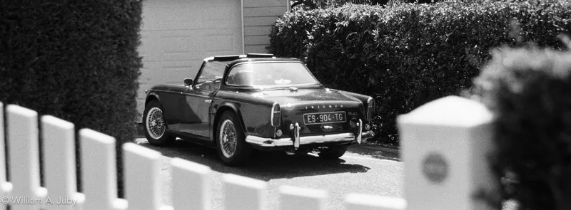 Triumph TR-4A shot on Cinestill BWXX with a Yashica FX-3, developed at L'Atelier Argentique, by WAJ