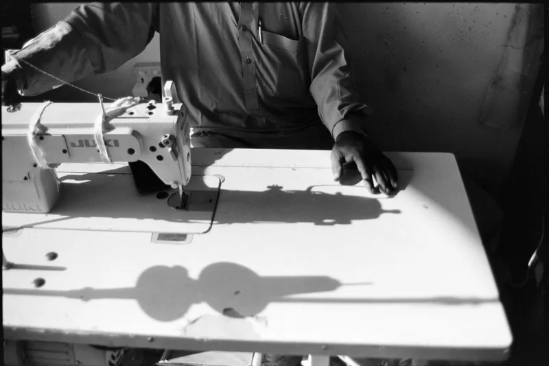Tailor hands shot on Kosmo Foto Mono 100 with a Canon AV-1, developed at Home / Self-Developed, by Faisal
