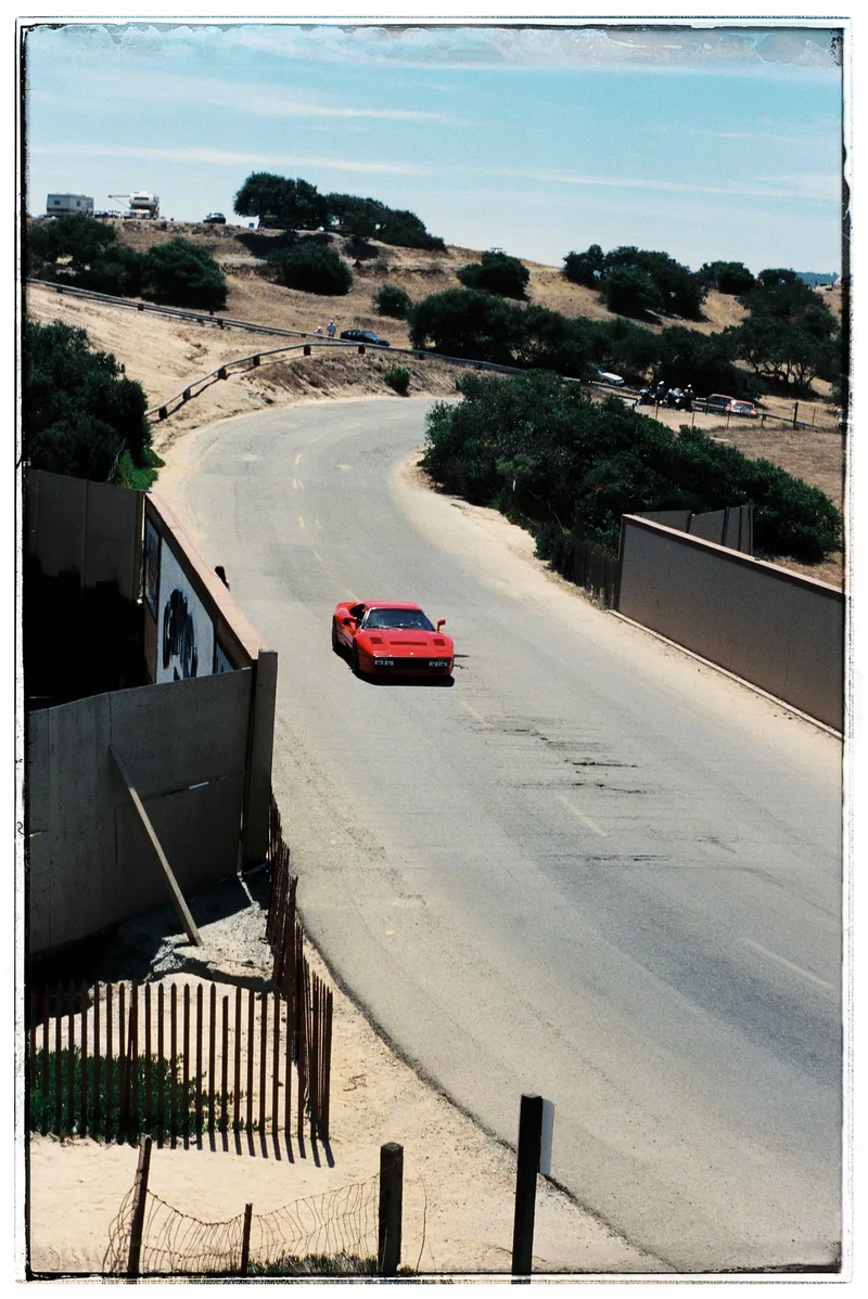288 GTO crossing the bridge before turn 6 at Laguna Seca shot on Kodak Gold 200 with a Ricoh KR-10 Super, by Nivola