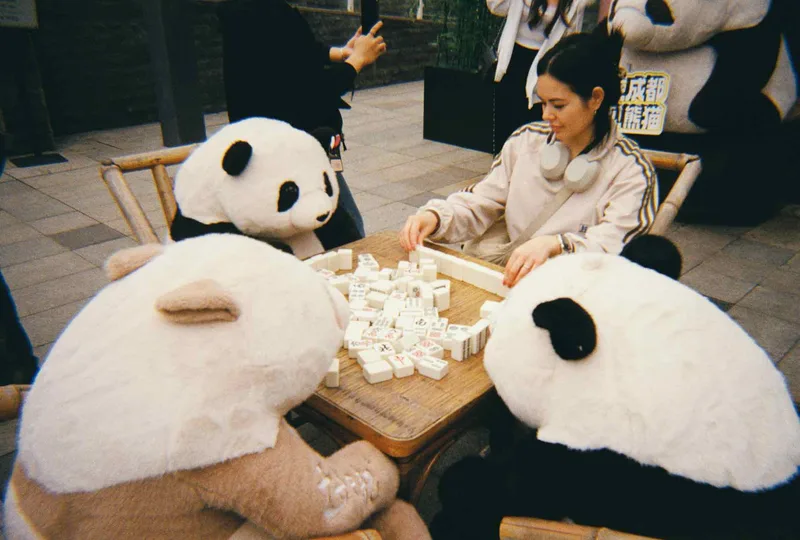 Playing Mahjong with pandas shot on Kodak Gold 200 with a Kodak M38, by Michelle