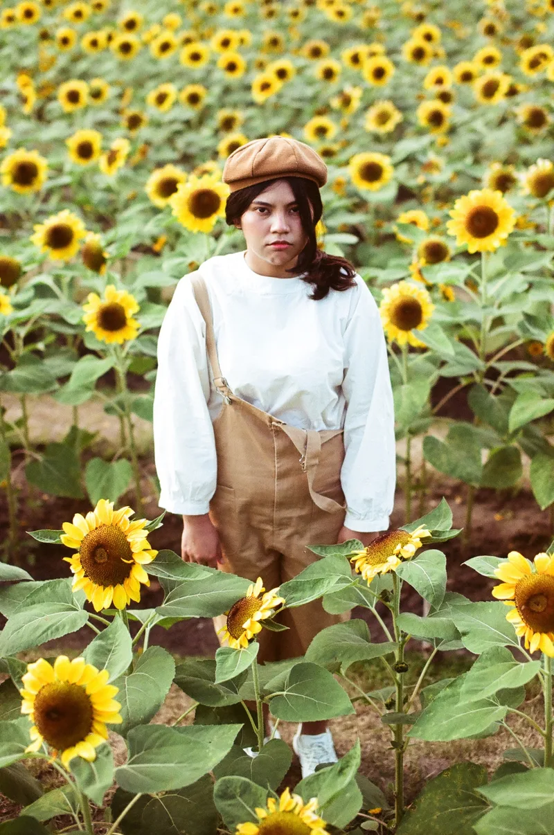 In a sunflower field shot on Kodak Portra 160 with a Canon Eos 55, developed at Home / Self-Developed, by NOT