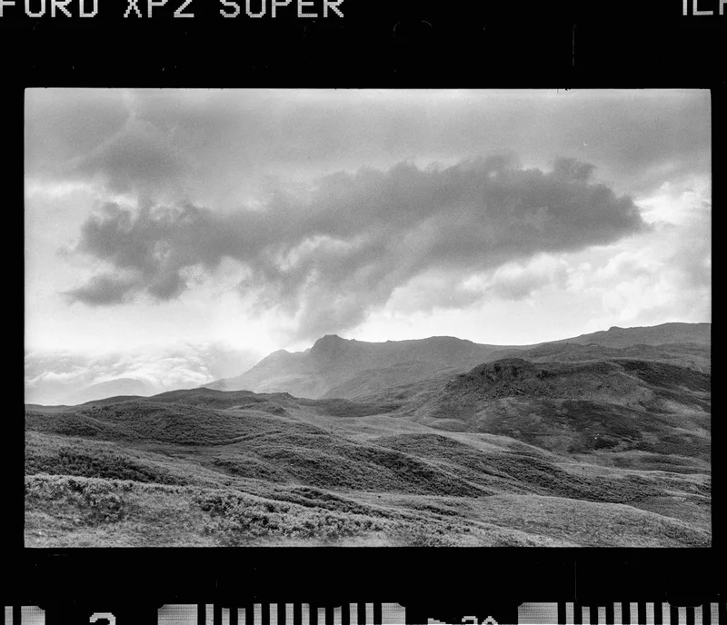 Drama over the Langdales shot on Ilford XP2 Super 400 with a Leica M4, developed at Home / Self-Developed, by Stuart Leeds
