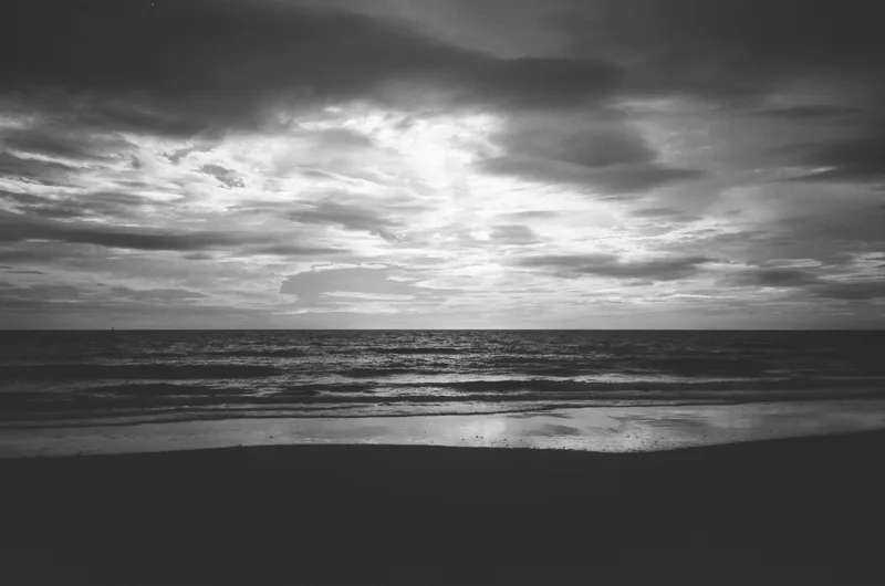 Sunrise at the beach shot on Fujifilm Neopan Acros 100 II with a Nikon L35AF, developed at Not Quite North, by Guesty