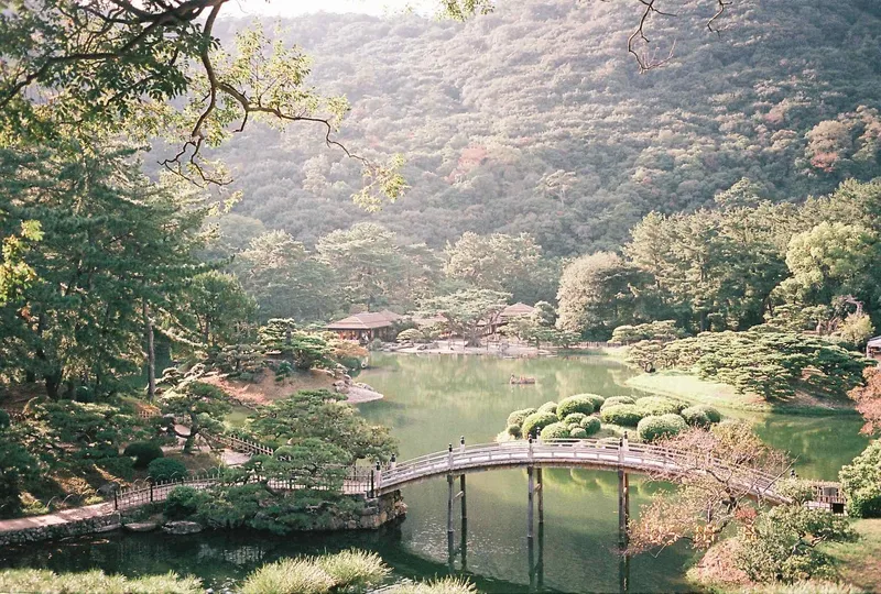 A pale view of hills shot on CatLABS X Film 100 Color with a Fuji ZoomCardiaMulti2000OP, by Zane