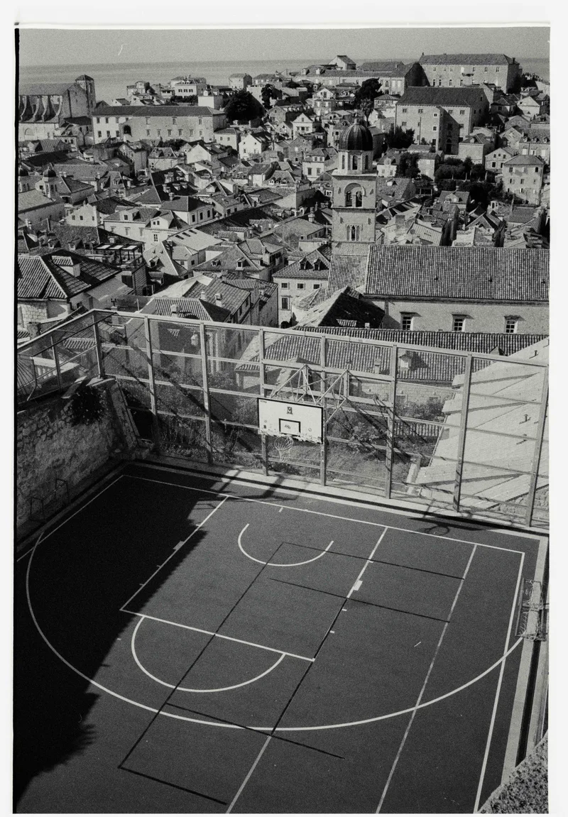 rooftop court, dubrovnik croatia shot on Ilford HP5 Plus 400 with a Konica Hexar AF, developed at Safelight, by Andrew