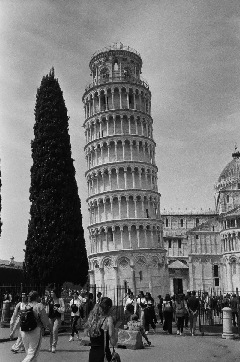 Leaning in Pisa shot on Agfa APX 400 with a Olympus Stylus 120, developed at Ars Imago, by Mustafa Tikiwala