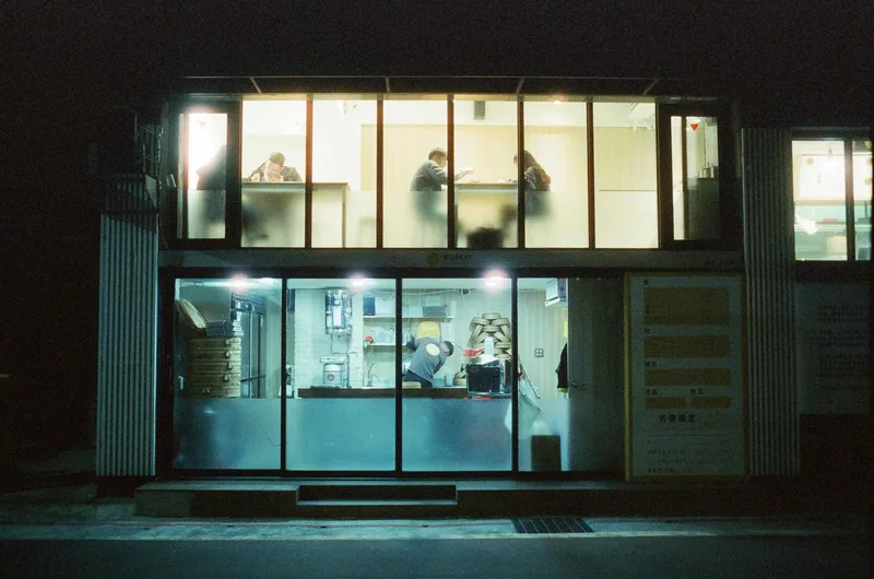 Moody dining in Taipei shot on Reflx Lab 800 with a Leica M4, developed at No Photo No Life, by Jon