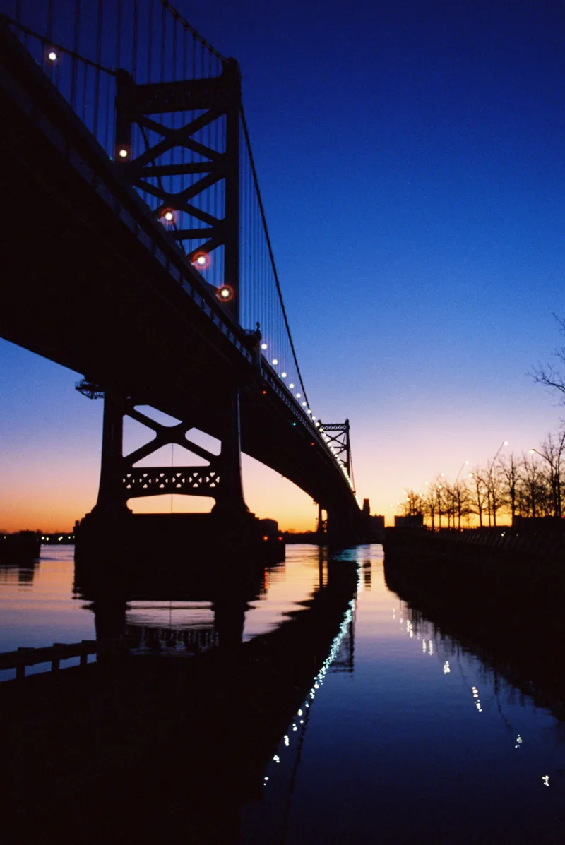 Ben Franklin Bridge shot on Cinestill 800T with a Olympus OM-4T, developed at Indie Photo, by alexonkow