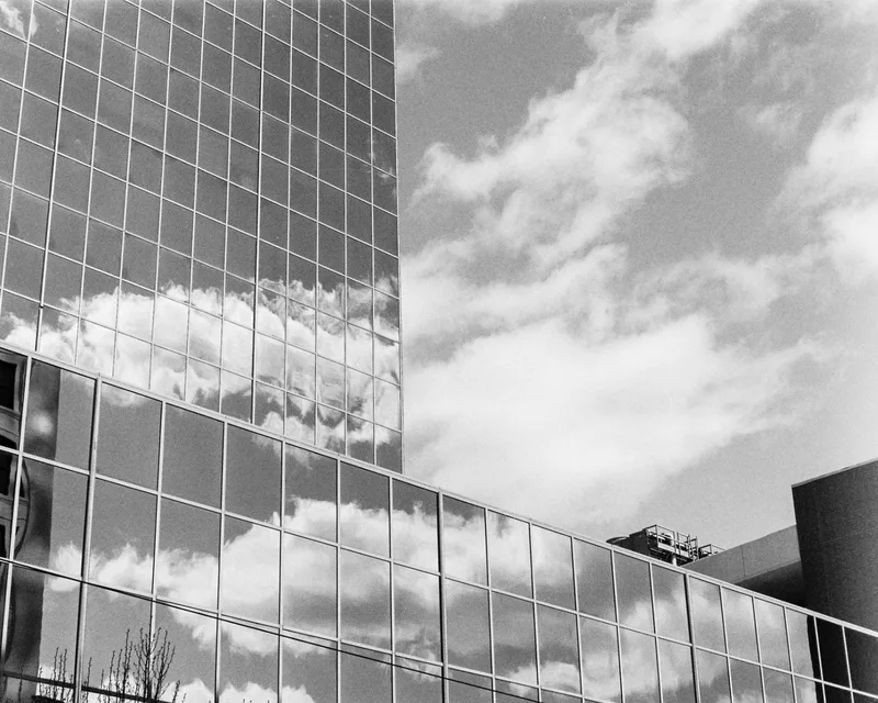 Clouds on Glass. Little Rock, Arkansas. 2025. shot on Ilford Kentmere Pan 400 with a Minolta X-570, by BradSimsPhoto