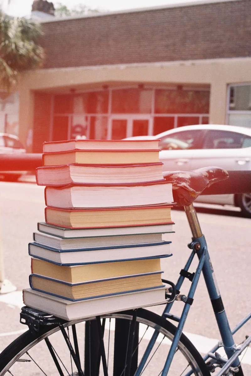 Take the books! shot on Kono! Original Sunstroke 200 with a Canon AE-1 Program, developed at Reformed Film Lab, by Ava Clark