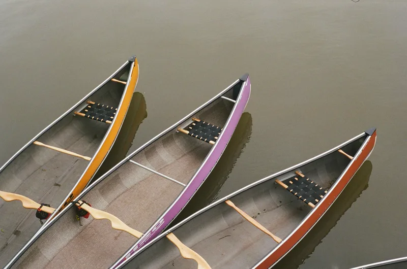 Canoes in Lake Victoria shot on Kodak UltraMax 400 with a Konica Autoreflex T, by Koda