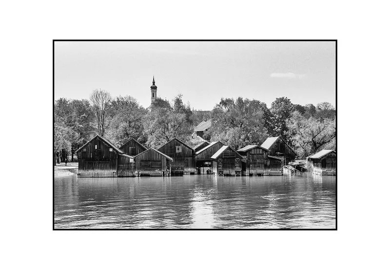 Boathouses shot on Kodak T-Max 100 with a Leica M7, developed at Sedan Sieben, by Christian