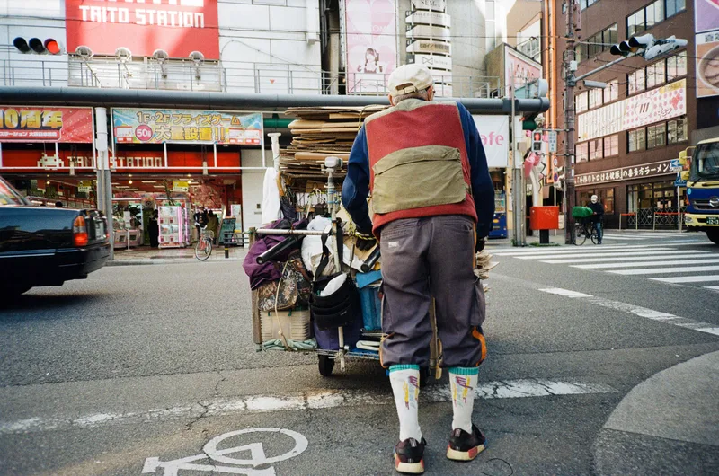 A man in Osaka shot on Kodak Gold 200 with a Ricoh R1, developed at The Print House Lab - REA, by ETgalim