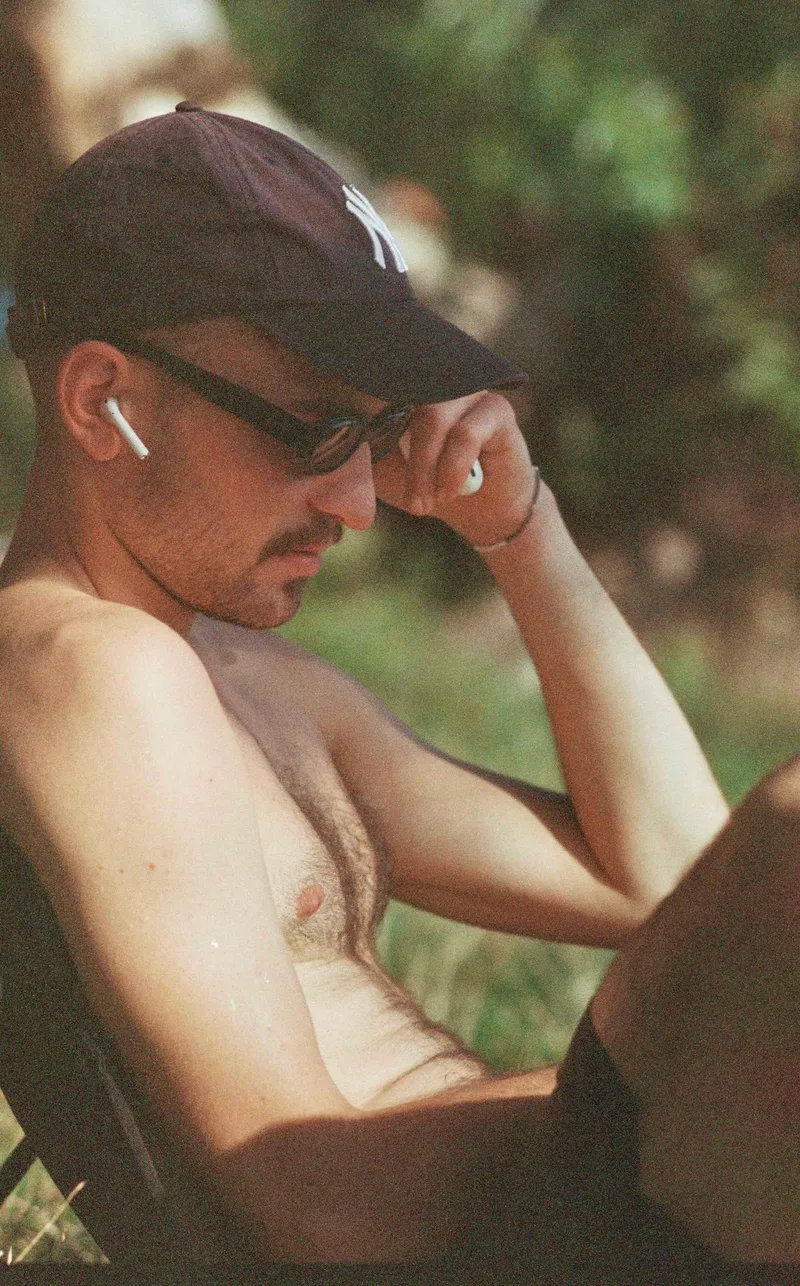 Reading in the sun shot on Kodak Gold 200 with a Leica RE, developed at Foto Kotti, by Nolin