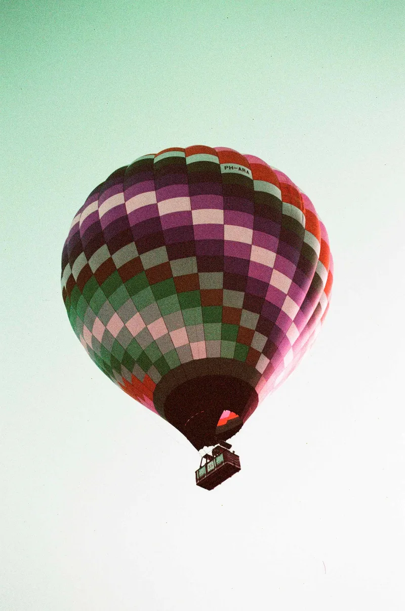 Balloon over Friesland shot on Lomography LomoChrome Purple 100 with a Canon EOS 300, by Tatiana