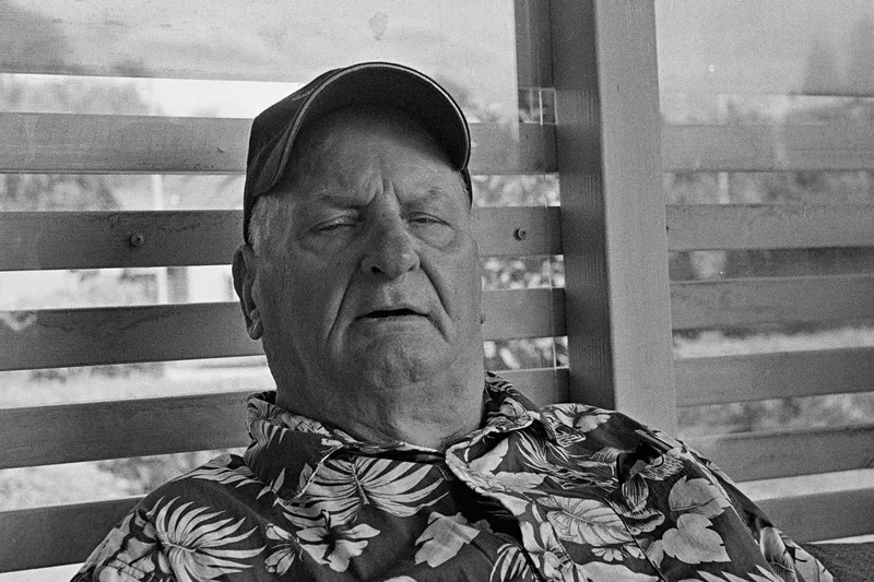Christer on the Porch shot on Ilford HP5 Plus 400 with a Zorki 4, developed at Home / Self-Developed, by lillepv