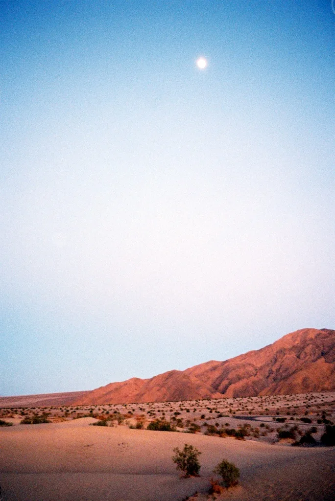 Desert Twilight Beneath a Pale Moon shot on Fuji Fujifilm 400 with a Minox 35 PL, developed at Emilio Film Lab, by Lon Dean