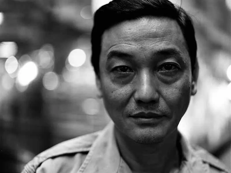 Yu Yoaopeng portrait artist shot on Ilford Delta 400 with a Mamiya 645E, developed at Luster Photo, by Markus Hofstätter