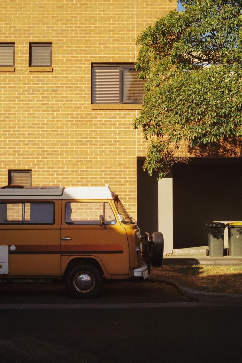 it's been parked here for months. same spot. i keep walking past and it keeps not moving. shot on Kodak Vision3 250D with a Pentax Spotmatic II, developed at Halide Express, by journey with goran