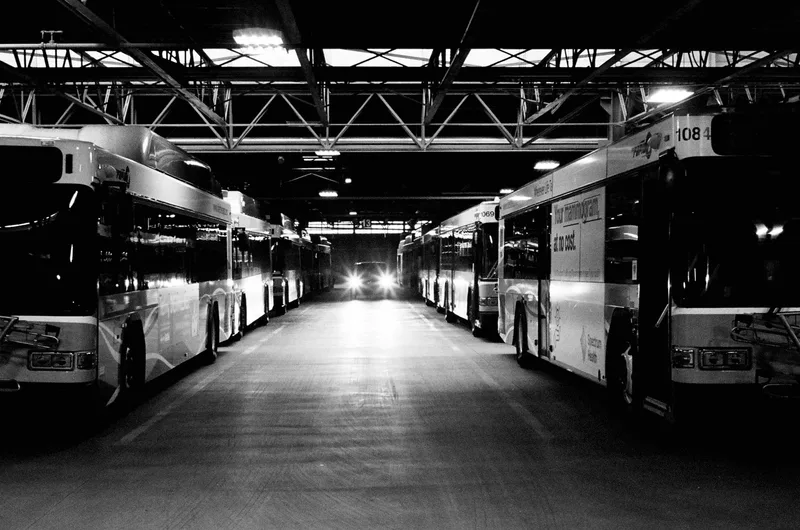 Bus Garage shot on Ilford HP5 Plus 400 with a Leica III, developed at The DarkRoom, by Curt Buckley