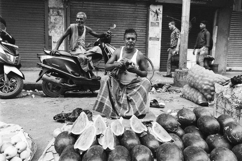 The Fruit sellers shot on Cinestill BWXX with a Nikon FA, developed at Camera house, by Pathikrit Das