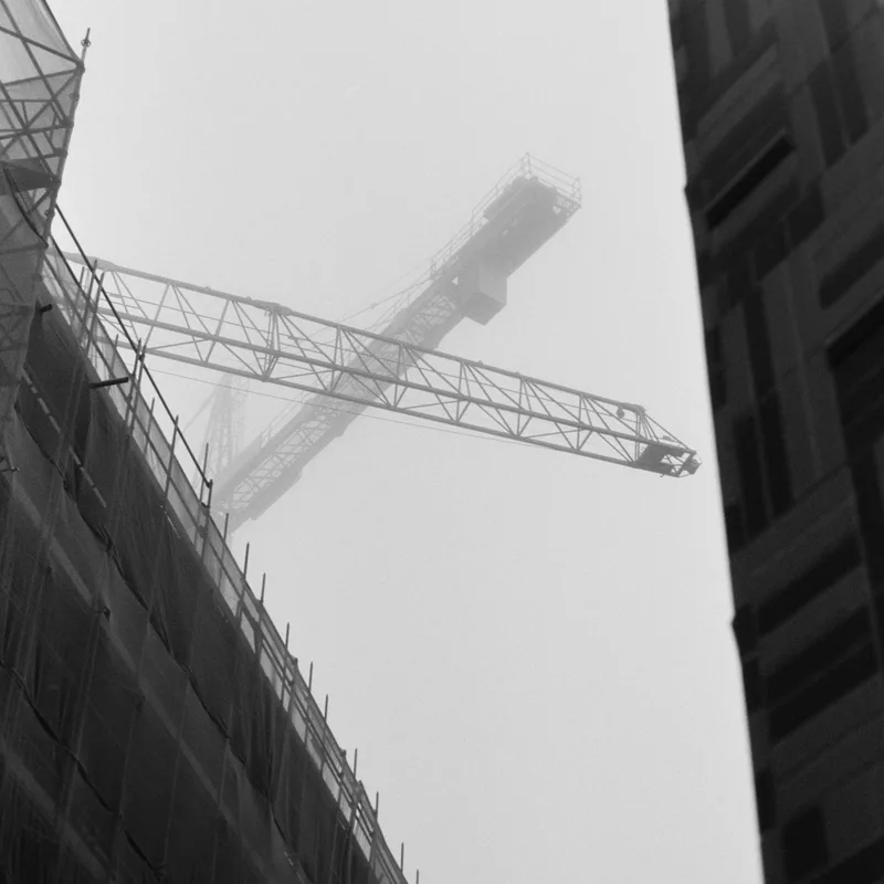Hazy cranes shot on Agfa APX 100 with a Olympus OM-10, by Sander