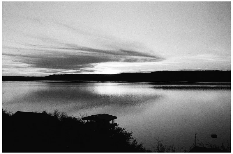 Clouds on the water shot on Ilford HP5 Plus 400 with a Leica MP, by micah
