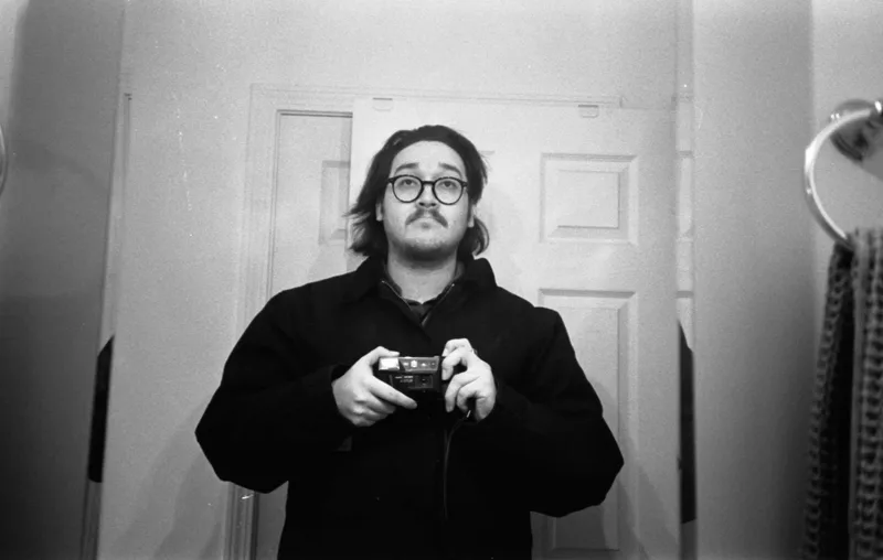self portrait shot on Kodak Tri-X 400 with a Kyocera TScope, developed at Home / Self-Developed, by Eric Wefald - Huang