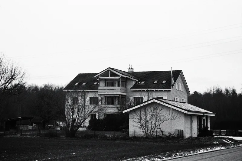 Just a house in my Swiss village shot on Ilford HP5 Plus 400 with a Olympus Mju Zoom 140, by PhotosByTim