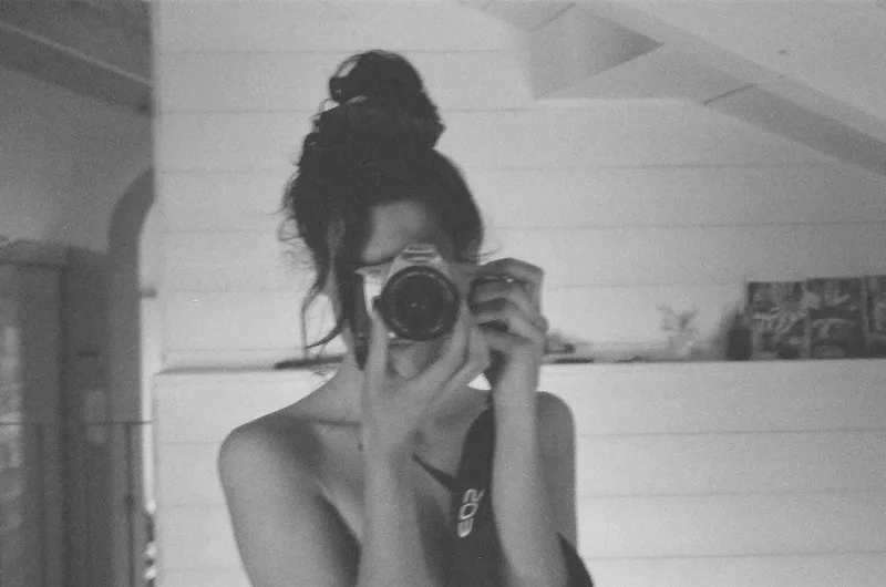 Mirror selfportrait shot on Ilford FP4 Plus 125 with a Canon 300v, by Giulia