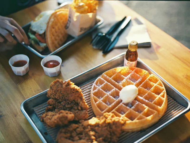 Chicken & waffles shot on Kodak Ektar 100 with a Mamiya 645 1000S, developed at Rewind Photo Lab, by Brian
