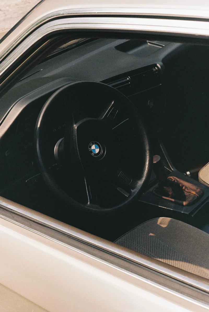 Bmw E30 shot on Kodak Gold 200 with a Minolta SR-T 101, developed at Lx_aomilimetro, by Ribeiro