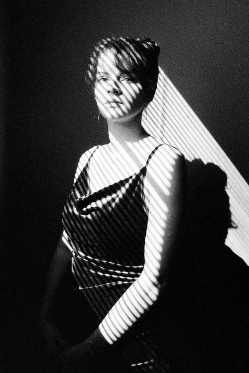 Window Portrait shot on Kodak T-Max P3200 with a Leica M5, developed at Blue Moon Camera & Machine, by Ethan