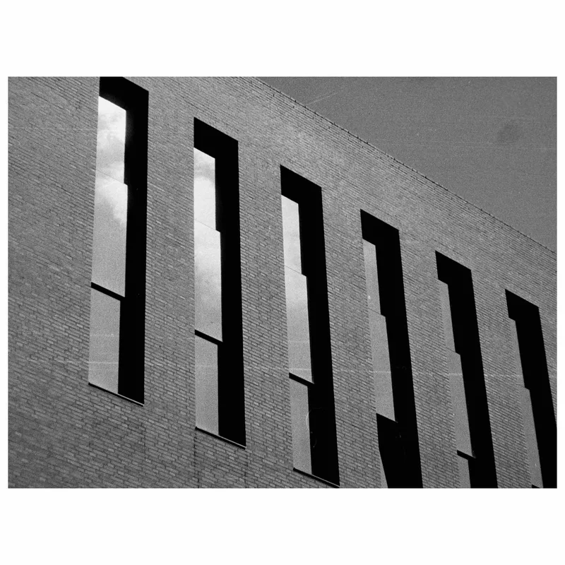 Clouds on reflections shot on Lomography Orca 110 with a Pentax Auto 110, developed at Film Speed Lab, by Mahendra Gudhakesa