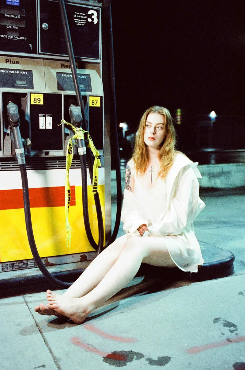 Gas Station Girl shot on Cinestill 800T with a Canon AE-1 Program, developed at Kenmore Camera Photo Lab, by Camilla