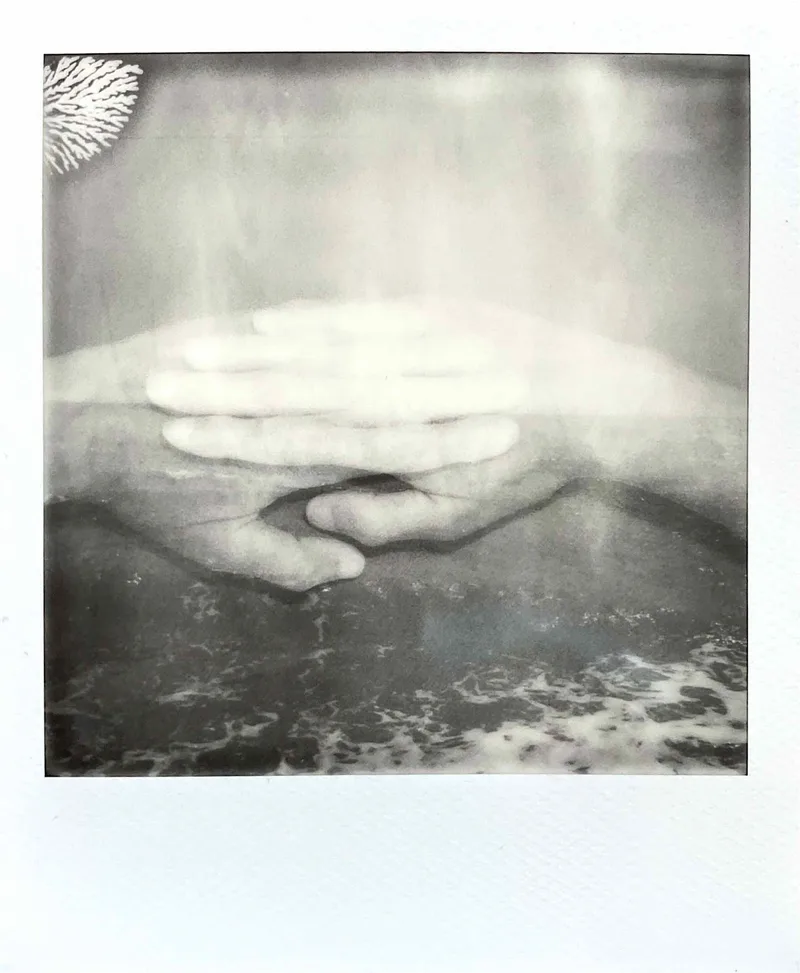 Hands across the water shot on Polaroid B&W i-Type with a Polaroid I-2, developed at Instant Film, by MelvynJ