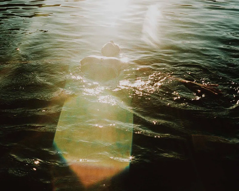 Summer shot on Psychedelic Blues 400 #2 with a Nikonos V, developed at Take It Easy, by Chris