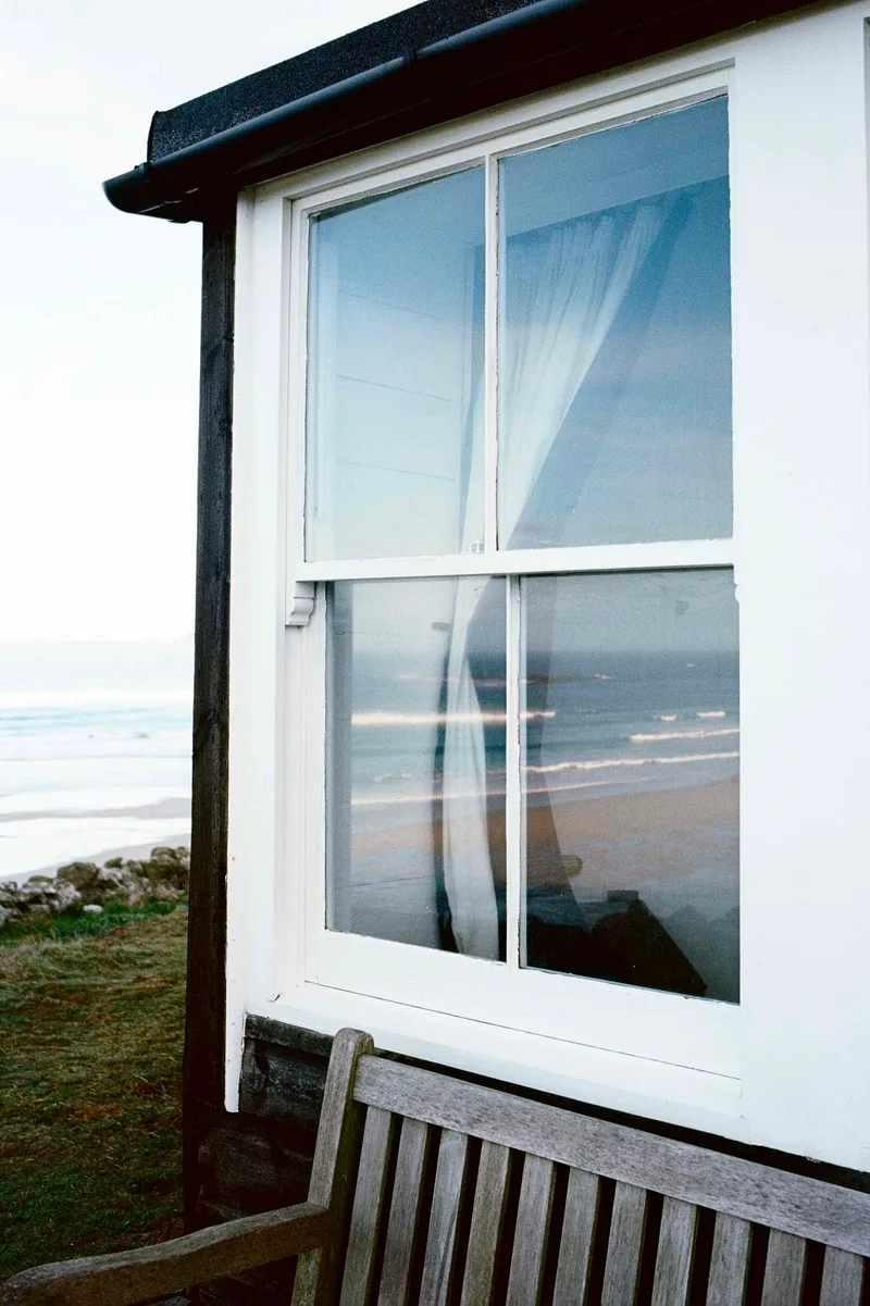 Reflective surf views shot on Kodak Portra 400 with a Konica Hexar AF, developed at AG Photolab, by Rick Davy