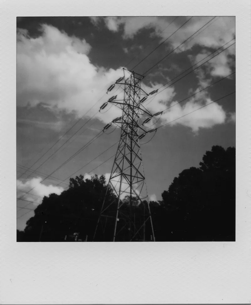 outside the grocery store shot on Polaroid B&W 600 with a Polaroid Sun 600, by Naomi
